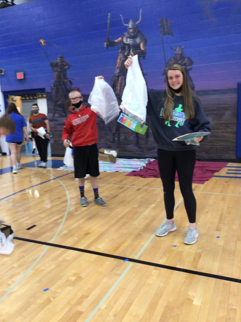 Bethany and Eli show off their parachutes